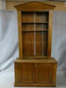 A 19th century pine Kitchen dresser with pokerwork vine leaf decorated arched pediment and open