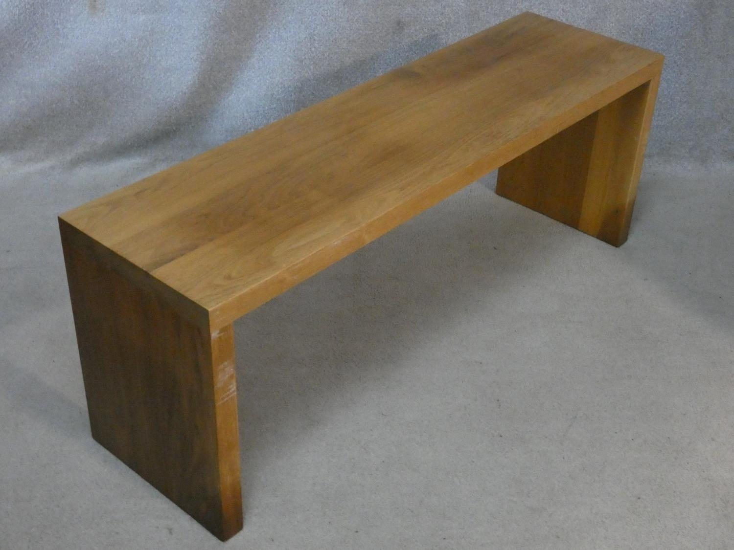 A pair of contemporary hardwood benches with planked top and supports. H.46.5 L.125.5 W.35cm - Image 2 of 3