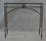 A Neoclassical style wrought iron console table with plate glass top. H.75.5 L.76 W.29cm