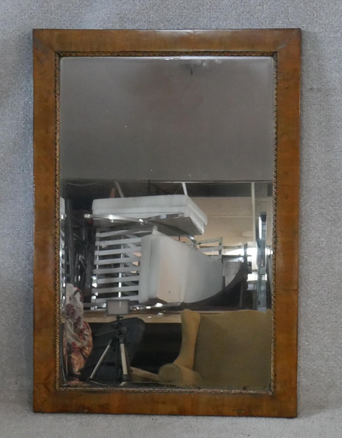 A 19th century walnut framed wall mirror with original bevelled plate within moulded gesso slip. H.