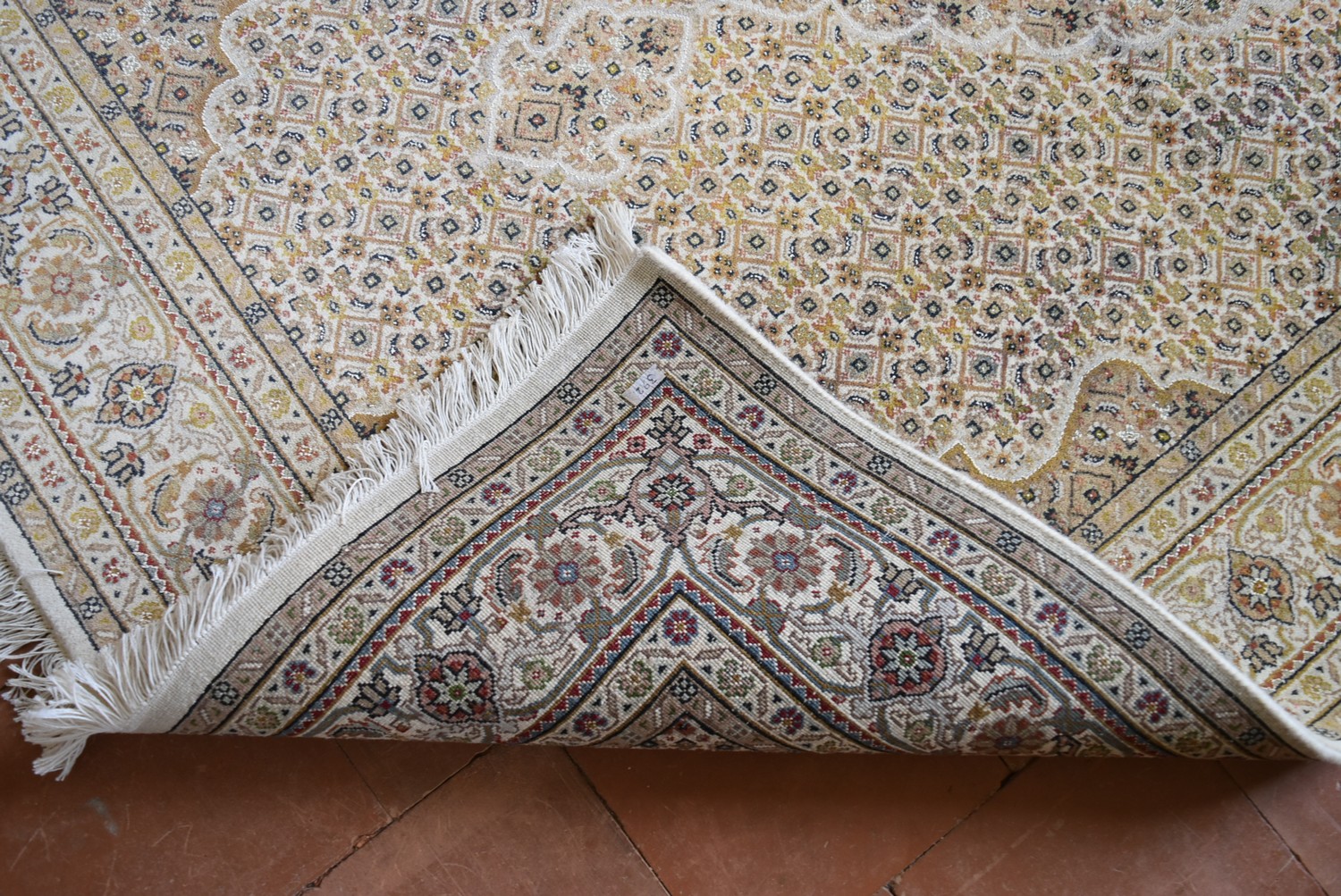 A silk & wool Tabriz style carpet with central medallion and repeating floral design across the fawn - Image 4 of 4