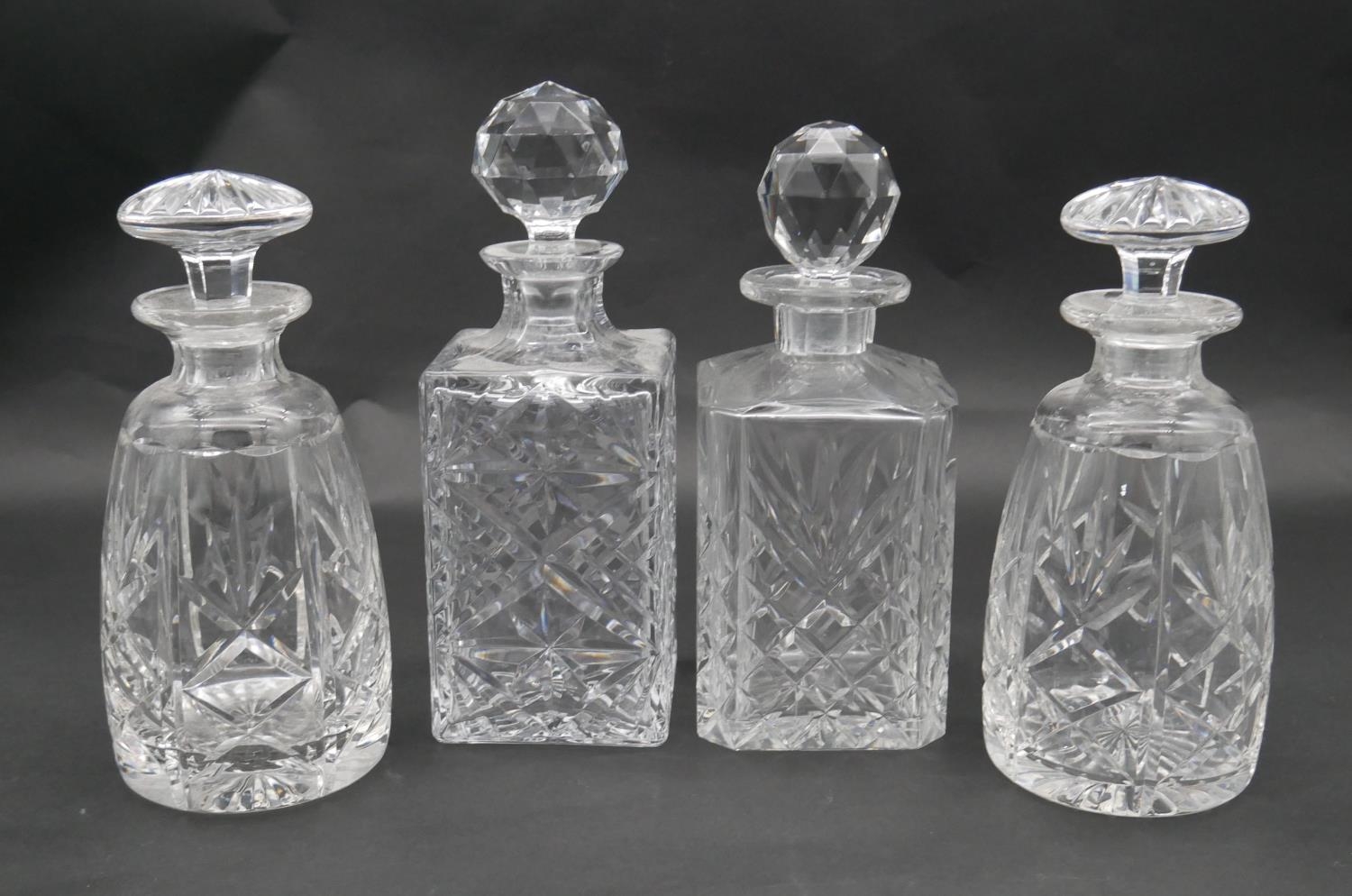 A pair of mallett form cut crystal decanters with stoppers and two other decanters. H.26.5cm (