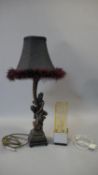 A vintage acrylic block light with a drilled hand in the centre along with a gilded moulded lamp