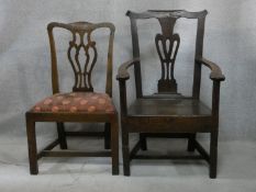 A Georgian country elm Chippendale style armchair with panel seat on square stretchered supports and