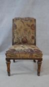 A 19th century walnut nursing chair on turned and fluted supports. H.75cm
