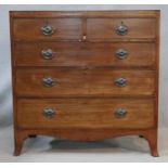 A Regency mahogany chest of drawers with satinwood and ebony stringing and original handles on swept