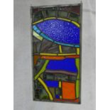 A mid century pane of stained and leaded modern coloured glass with antique and gothic