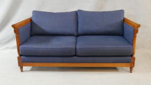 A contemporary French Empire style beech framed canape in calico upholstery. H.73 W.176.5 D.73cm