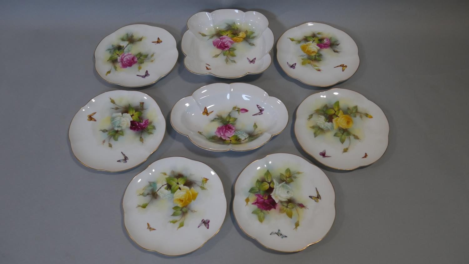 An antique Hadley Roses Royal Worcester hand painted cake set. Including six plates and two