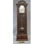 A French Provincial style mahogany cased longcase clock with brass face and silvered dial and