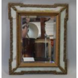 A 19th century gesso and painted wall mirror with glazed frame and original bevelled plate. H.60 W.