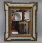 A 19th century gesso and painted wall mirror with glazed frame and original bevelled plate. H.60 W.