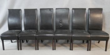 A set of six leather upholstered high back dining chairs on square tapering ebonised supports. H.
