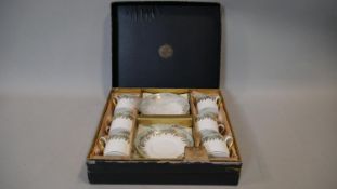 A Hammersley six person gilded fern and pale blue design boxed coffee set, as new D.13cm (Saucer)