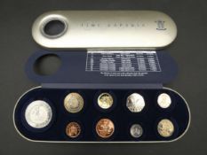 A Great Britain 2000 Royal Mint Time Capsule tin. Containing 9 coins, with COA. Limited edition