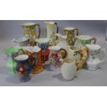 A collection of hand painted Carlton Ware, Royal Doulton, Wade and other vintage ceramic jugs.