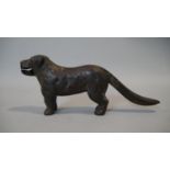 A C.1900 cast iron nutcracker in the form of a dog. L.30cm