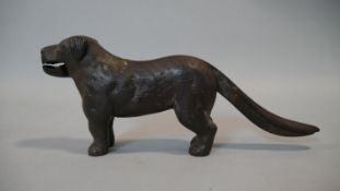 A C.1900 cast iron nutcracker in the form of a dog. L.30cm