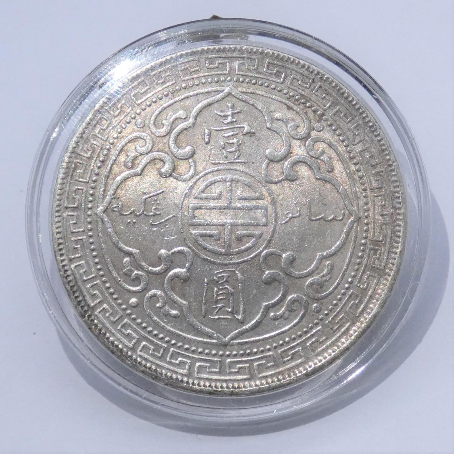 A 1909 Hong Kong silver trading dollar in capsule case. With COA. Weight 28g From a private - Image 2 of 3