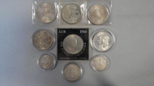 Nine silver coins in cases. Including a 1965 Sir Winston Churchill commemorative silver proof crown,