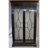 A Georgian style mahogany and satinwood inlaid and strung display cabinet with astragal glazed doors