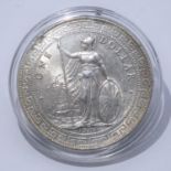 A 1909 Hong Kong silver trading dollar in capsule case. With COA. Weight 28g From a private