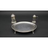 A Georgian oval silver mint tray on four feet with engraved laurel decoration and Greek key design