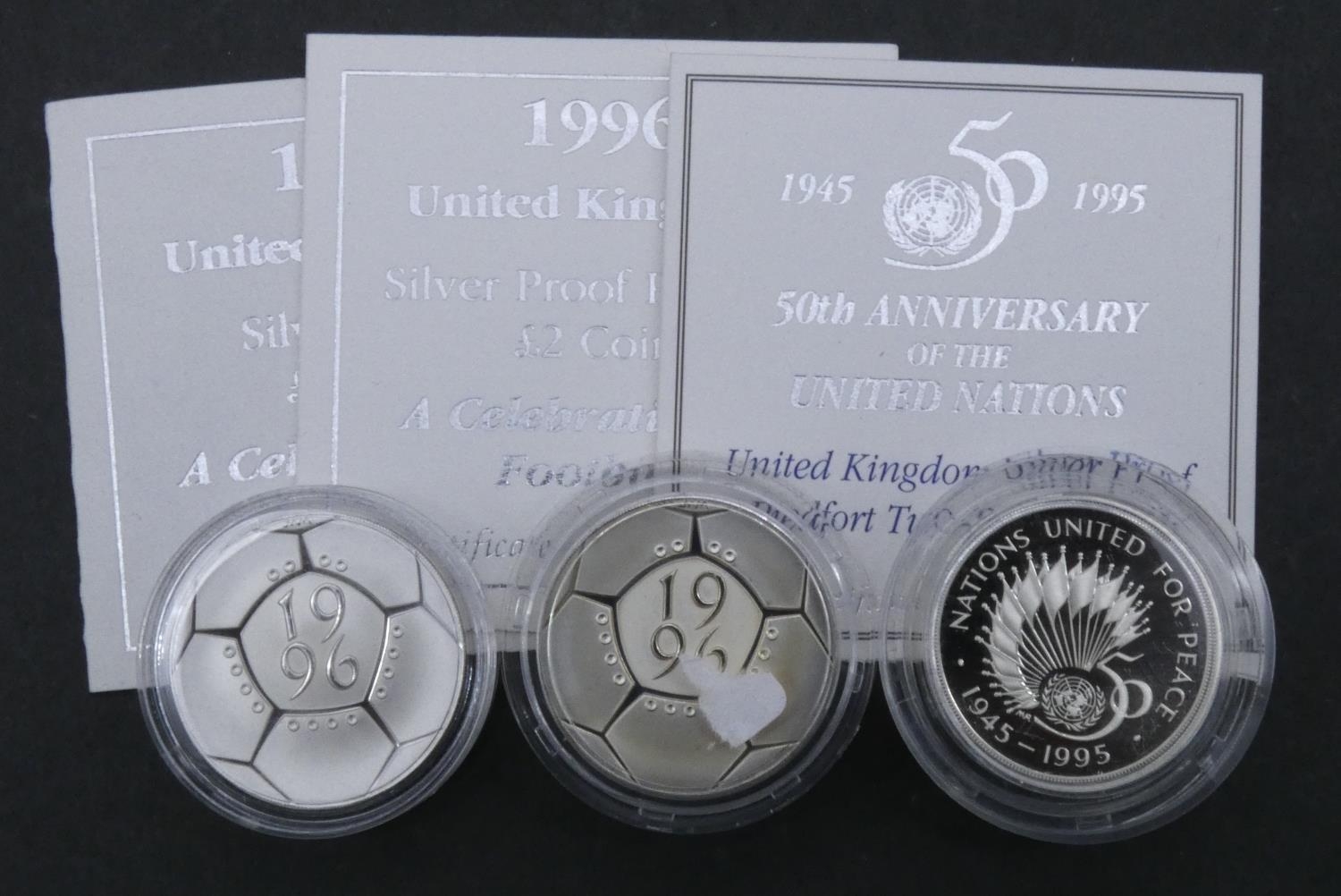 Three silver proof coins. A 1996 Royal Mint silver proof Piedfort "A Celebration of Football" two - Image 2 of 5