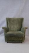 A mid century vintage armchair in buttoned upholstery. H.77 W.78 D.81cm