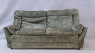 A mid century vintage two seater sofa. H.70 W.158 D.88cm