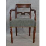 A Regency mahogany carved bar-back armchair on tapering ring turned supports. H.79cm