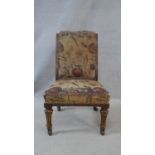 A 19th century walnut nursing chair on turned and fluted supports. H.75cm