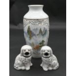 A pair of 19th century Staffordshire style dogs and a painted and glazed Japanese vase. H.25cm