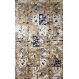 A Bakhtiar Design carpet with floral panels across the field enclosed by stylised geometric borders.