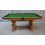 A mid century light oak framed half size snooker table converting to dining table with maker's