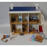 A vintage scratch built doll's house complete with furniture and effects. H.60 L.60 W.24cm