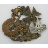 Five military cap and collar badges. Including a WW1 King's Royal Rifle Corps cap badge, a Royal