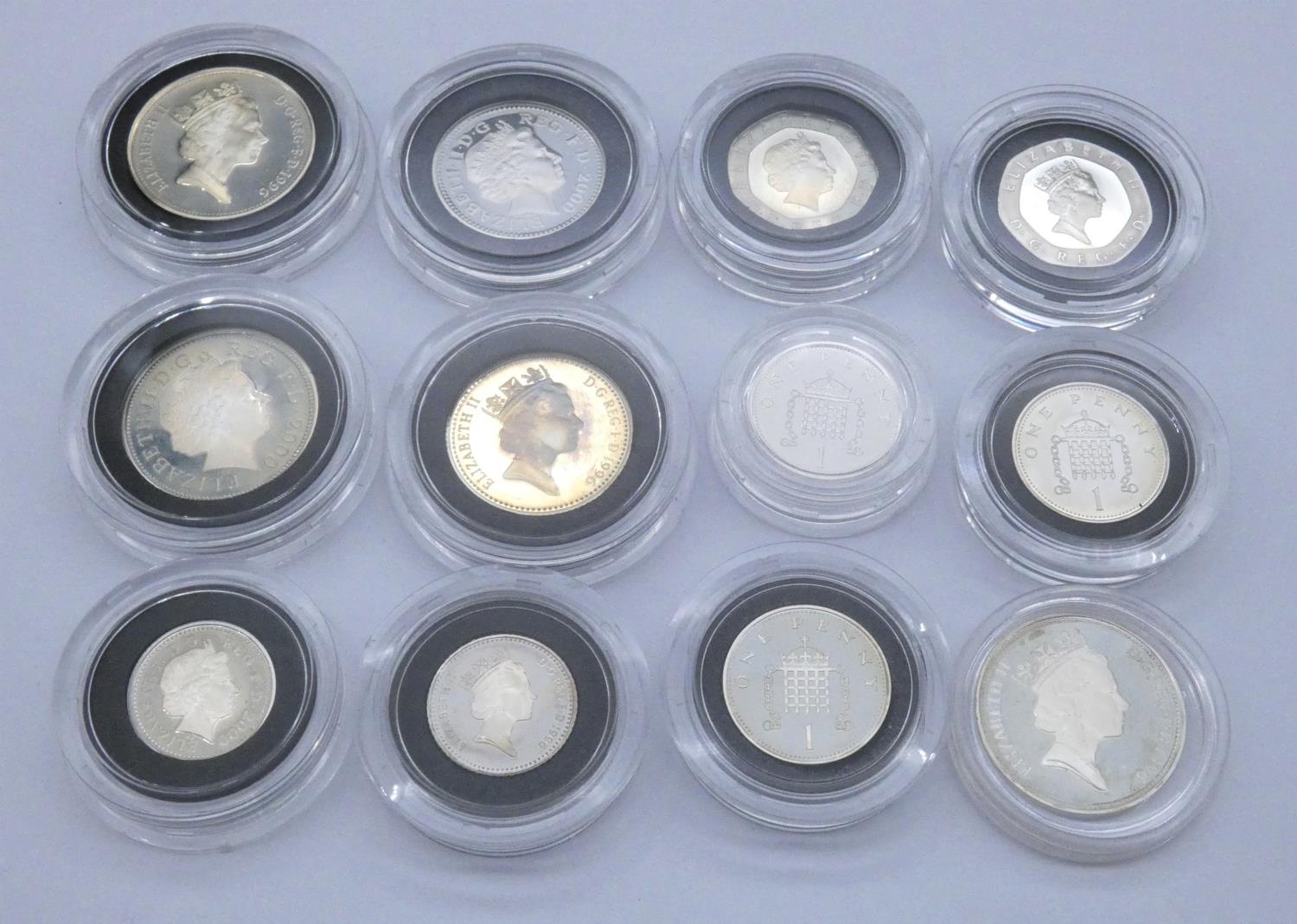 Twelve silver proof coins in capsules including three two pence coins, three one pence coins, two