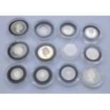 Twelve silver proof coins in capsules including three two pence coins, three one pence coins, two