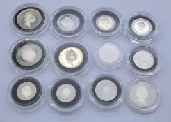 Twelve silver proof coins in capsules including three two pence coins, three one pence coins, two