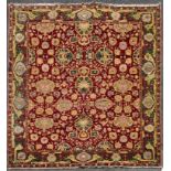 A fine large Agra carpet with all over repeating scrolling palmette and lotus flower decoration on a