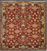 A fine large Agra carpet with all over repeating scrolling palmette and lotus flower decoration on a