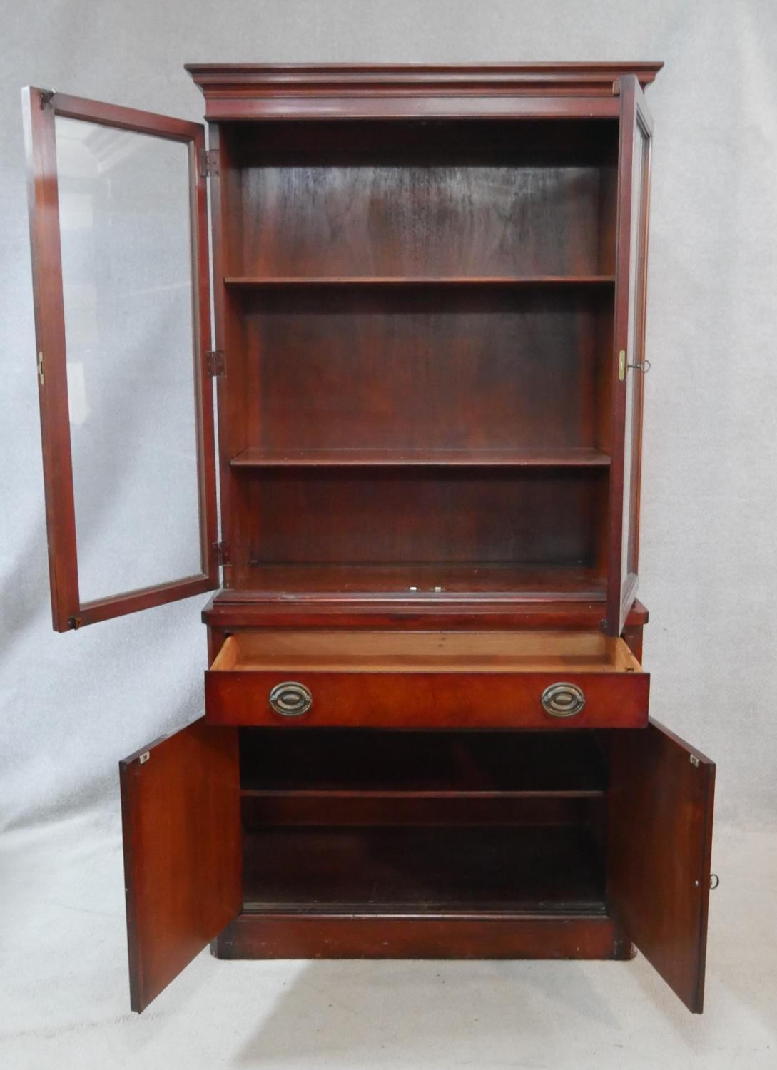 A Georgian style mahogany library bookcase with glazed doors enclosing shelves above frieze drawer - Image 2 of 6