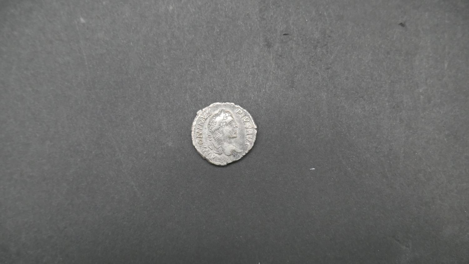 Four ancient Roman coins. Including an ancient roman silver coin depicting Securitas seated on a - Image 5 of 9