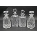 A pair of mallett form cut crystal decanters with stoppers and two other decanters. H.26.5cm (