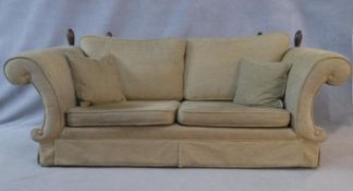 A Knole style two seater sofa with extra fabric. H.93.5 L.229 D.97cm (The arms are fixed).