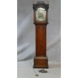 A Georgian mahogany cased longcase clock with urn form brass finials, the eight day movement by