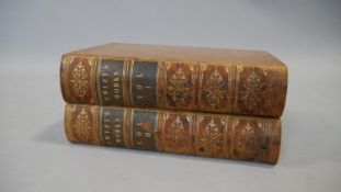 Two 19th century leather bound gilded volumes of Swift's Works, with marbling to the page edges. H.