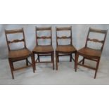 A set of four 19th century country fruitwood bar back dining chairs with panel seats on square