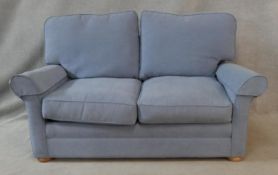 A contemporary two seater sofa bed. H.80 W.176 D.85cm (Sofa) L.177 W.113cm (Mattress)